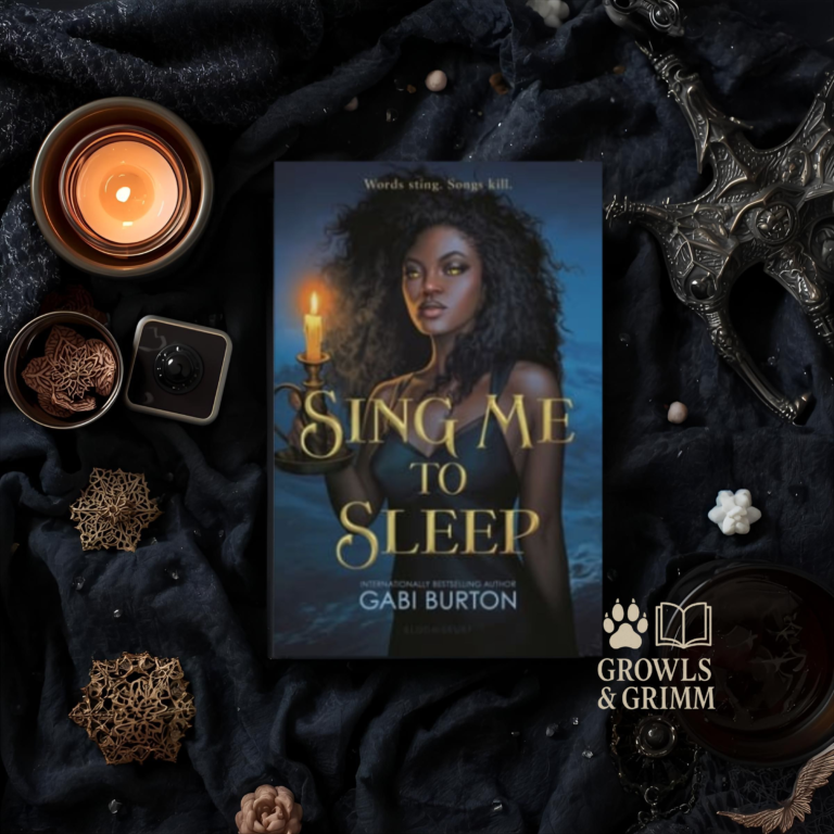 Gothic flat lay featuring Sing Me to Sleep by Gabi Burton, surrounded by candles and dark florals. Growls and Grimm